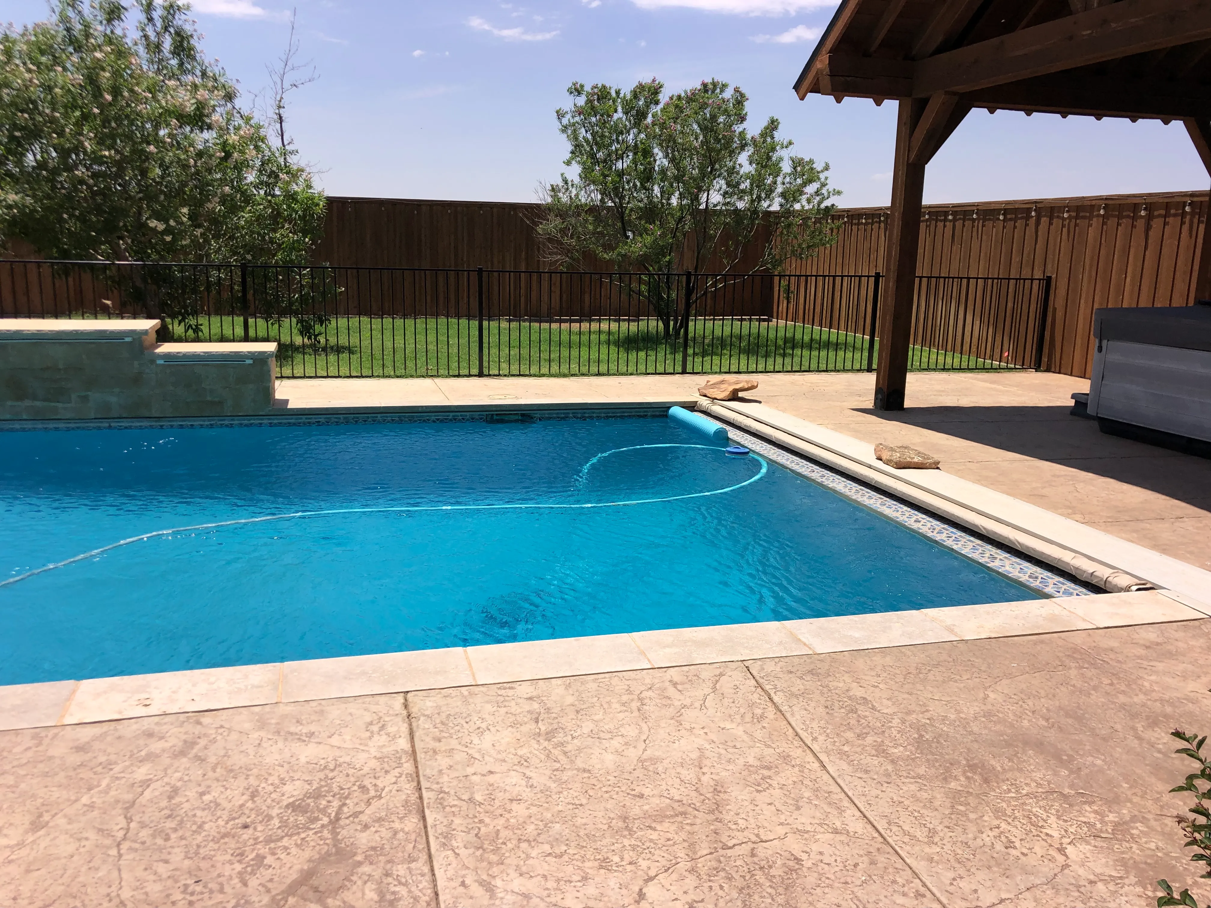 Welded ornamental metal gate designed for pool safety entry in Lubbock Texas