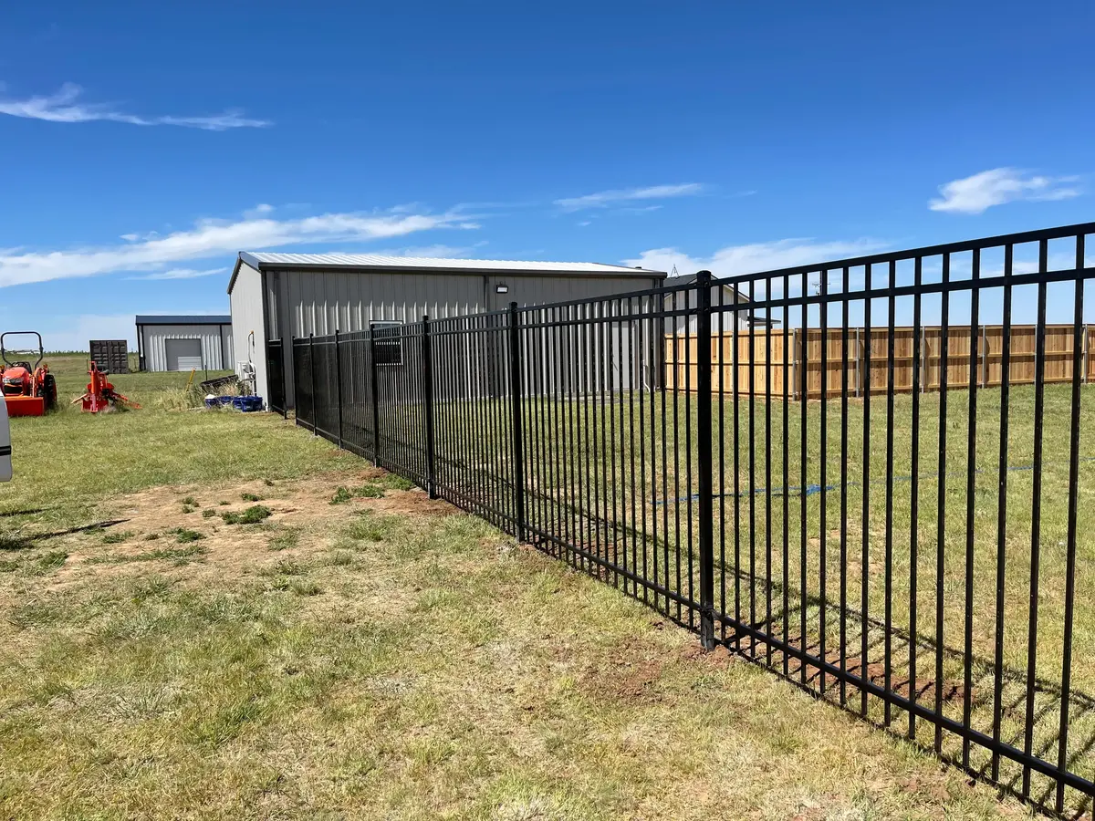 Decorative Iron fence encloseing acreage