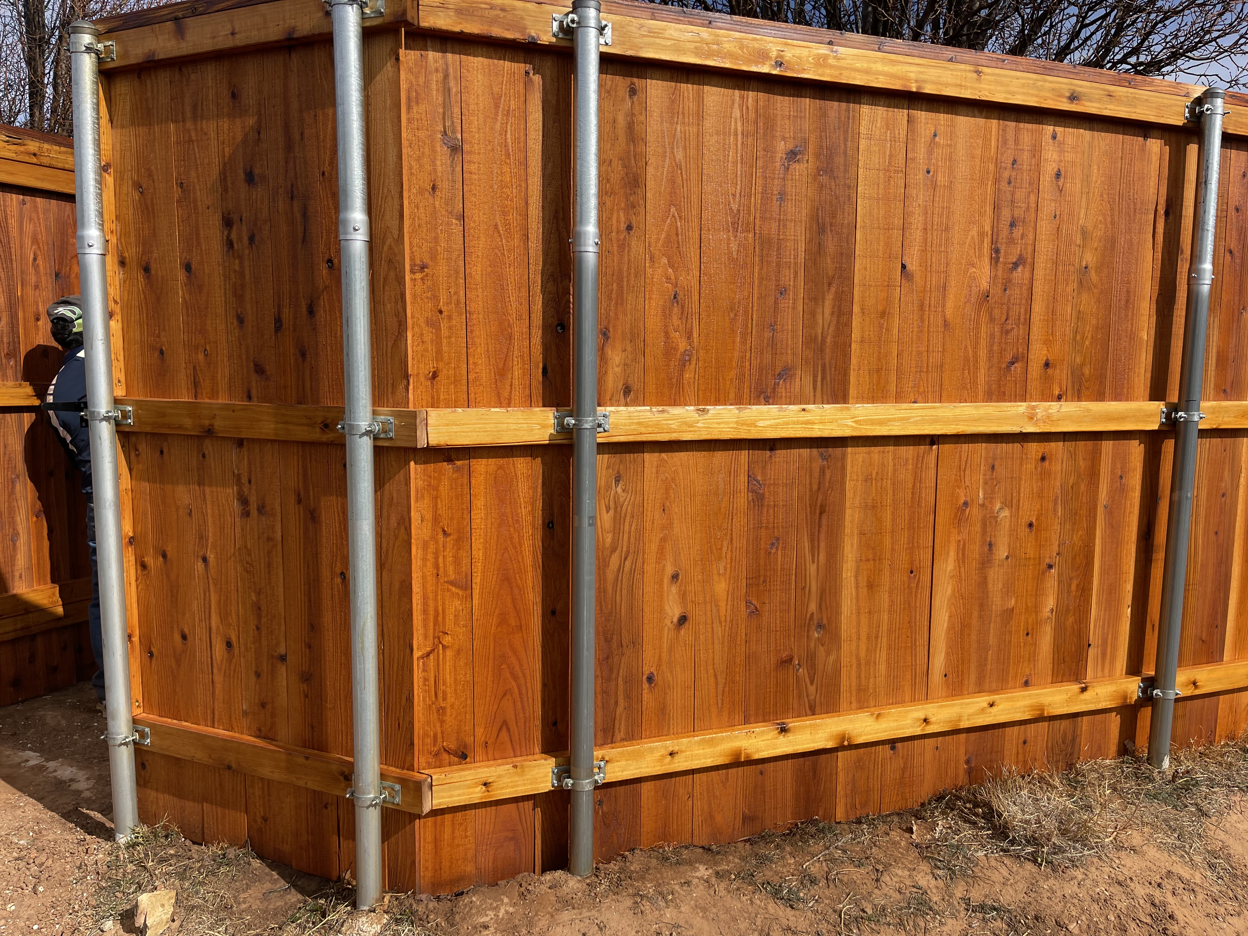 7-ft cedar fence w/ cedar tone stain protection