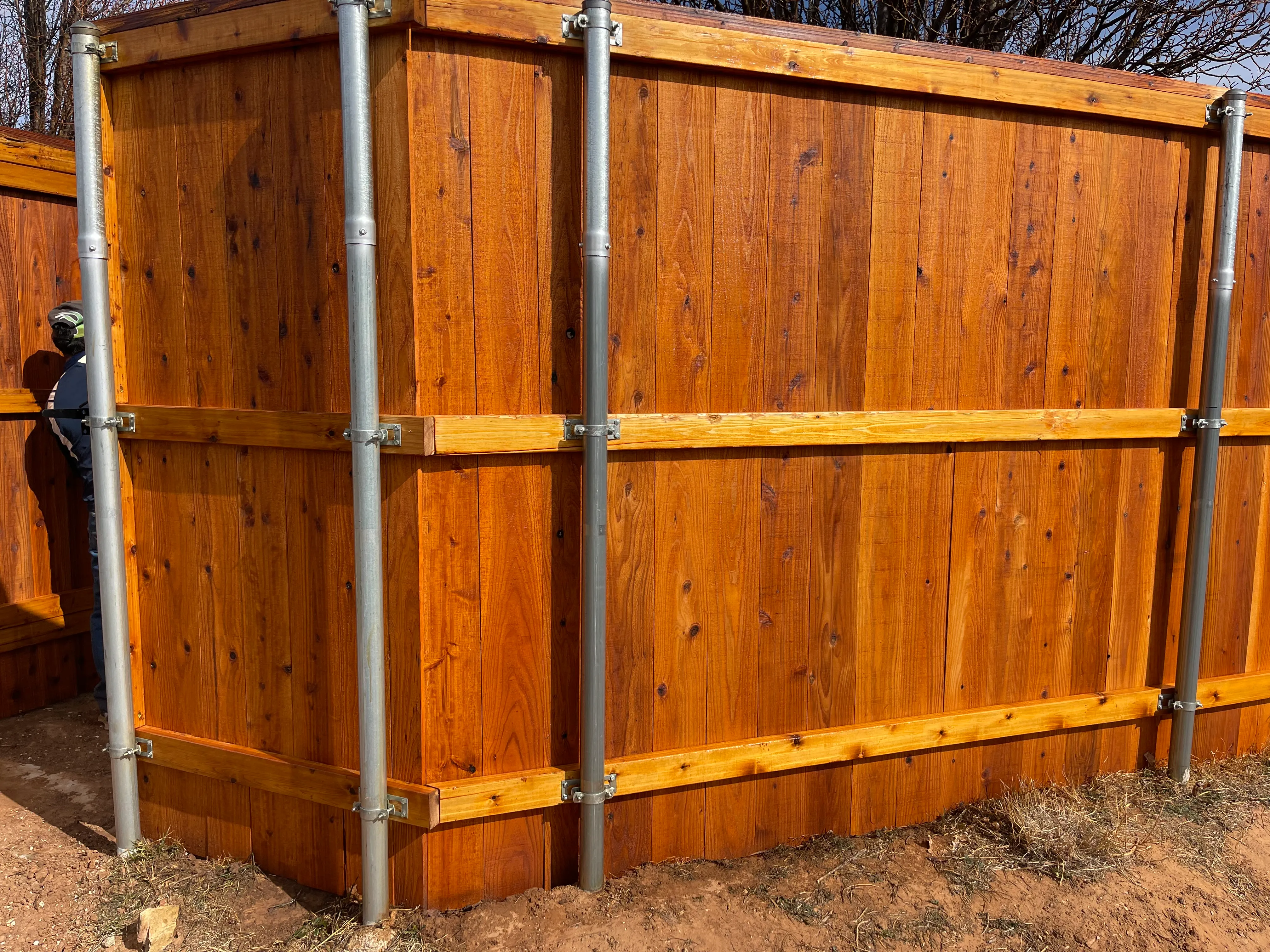 Corner view of cedar privacy fence with even board spacing and clean edges