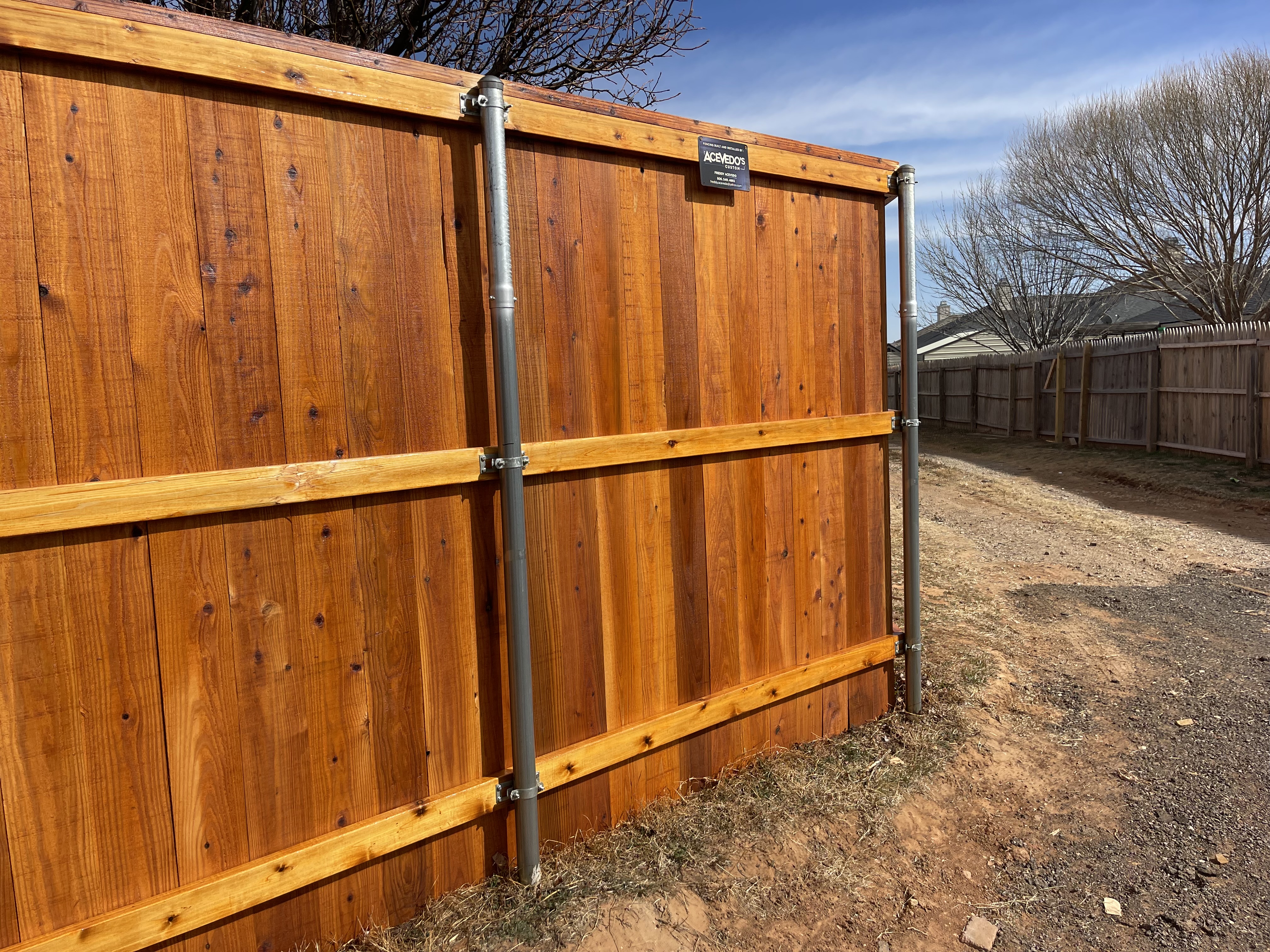 7-ft cedar fence w/ cedar tone stain protection