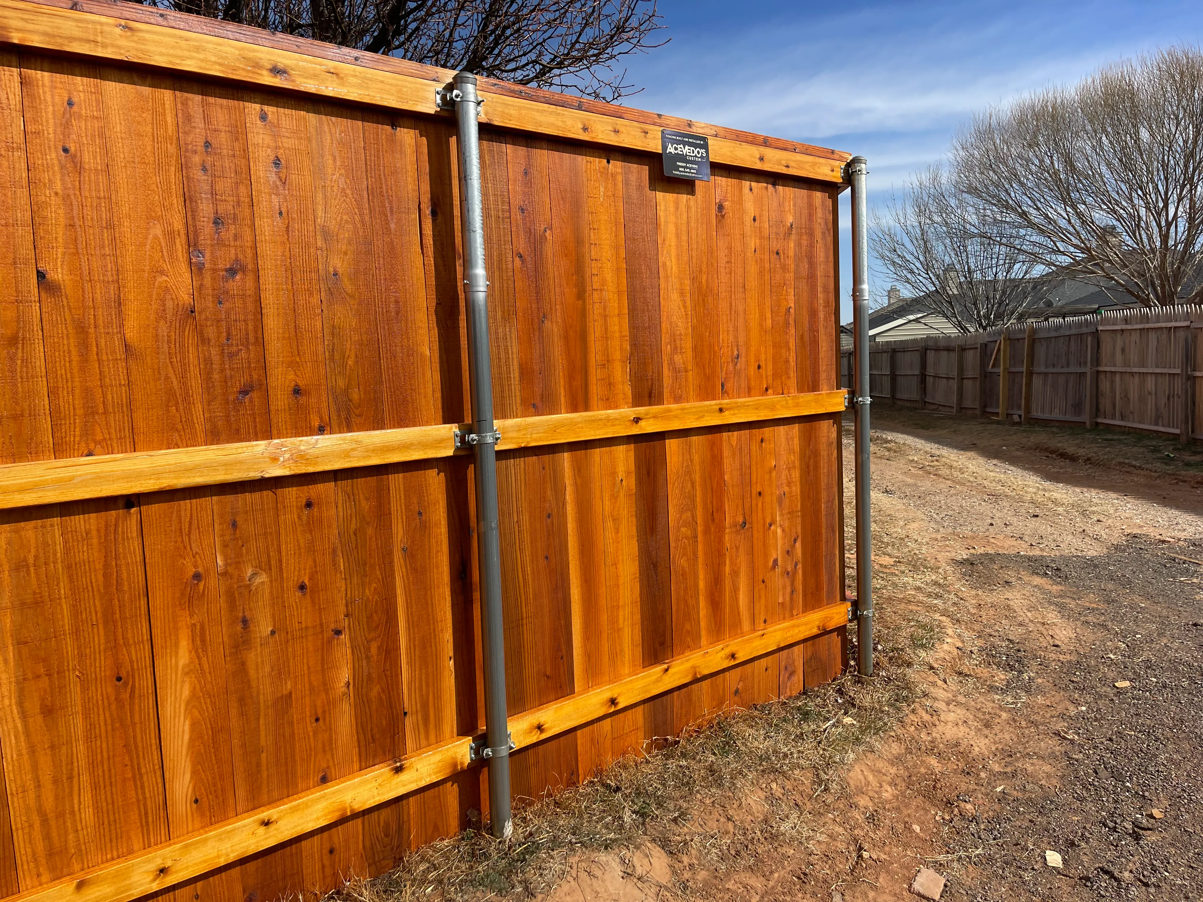 Close-up of cedar-tone stain color on cedar pickets