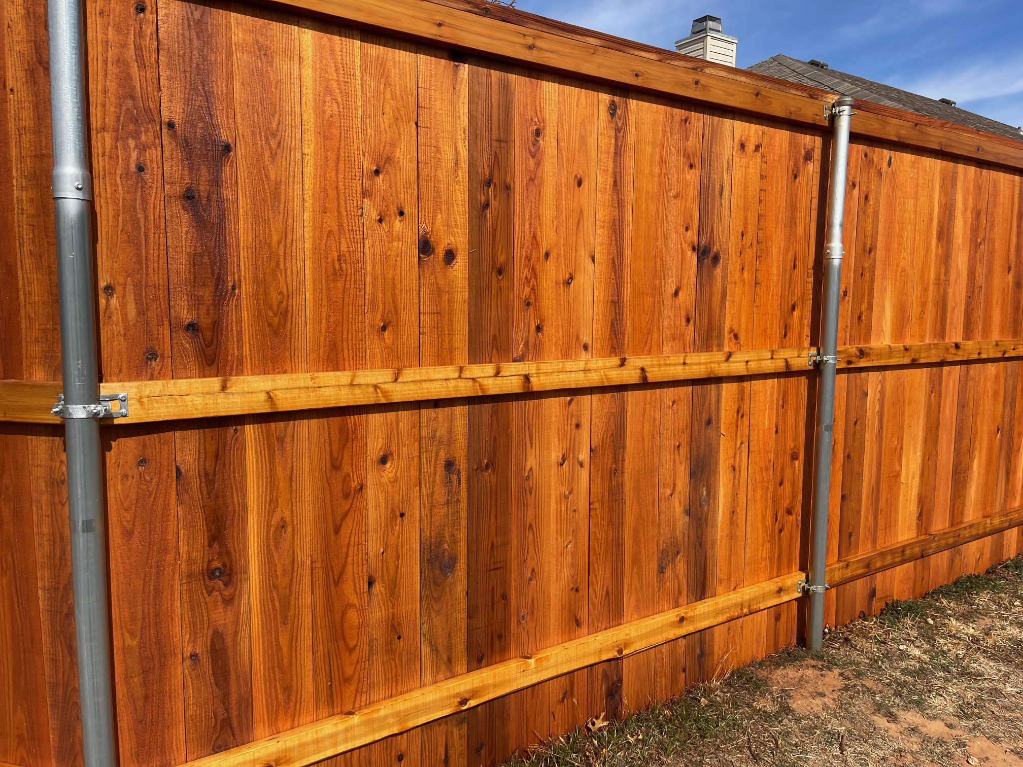 7-ft cedar fence w/ cedar tone stain protection