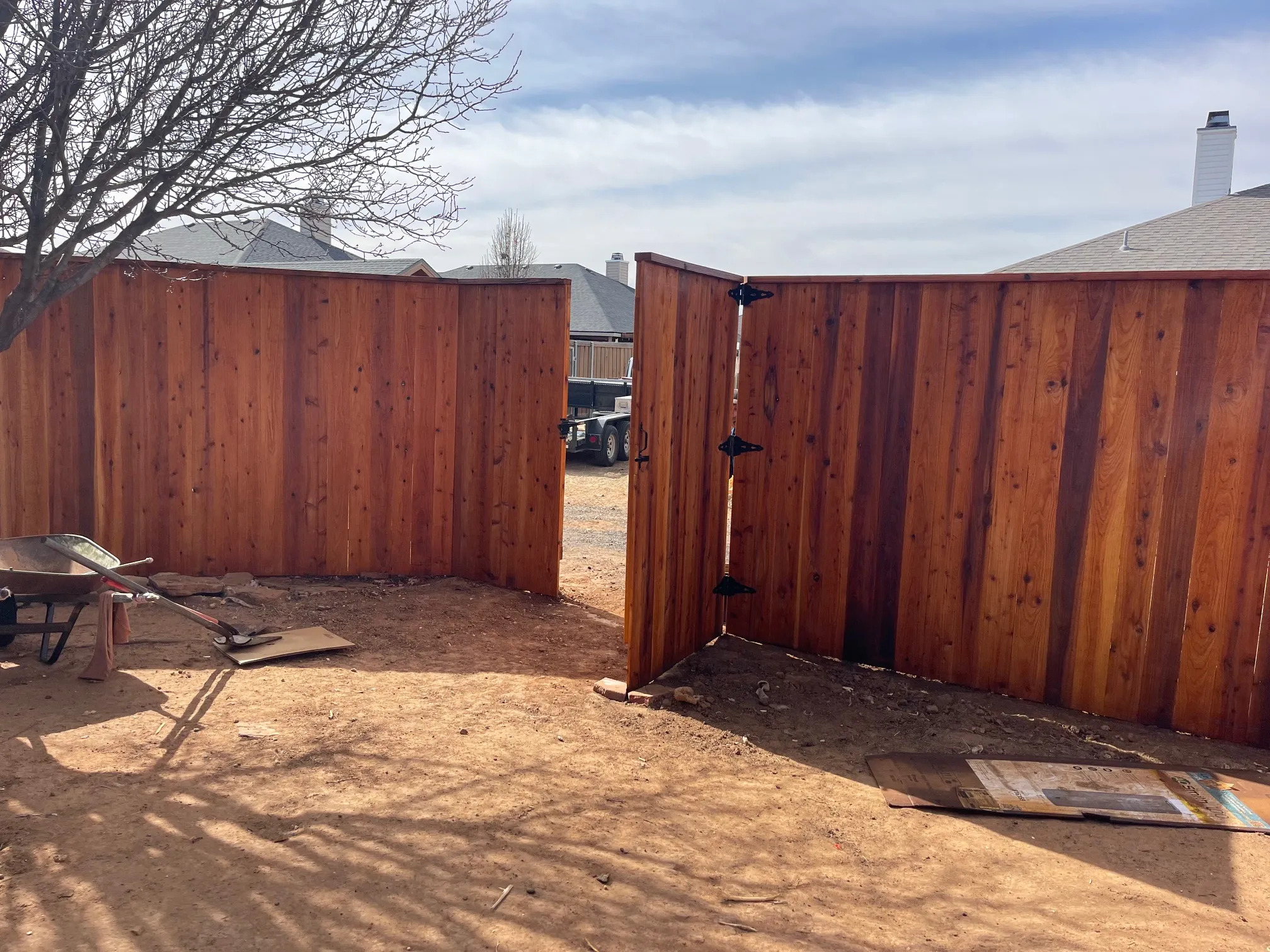 Cedar fence with clean top line and protective stain finish applied