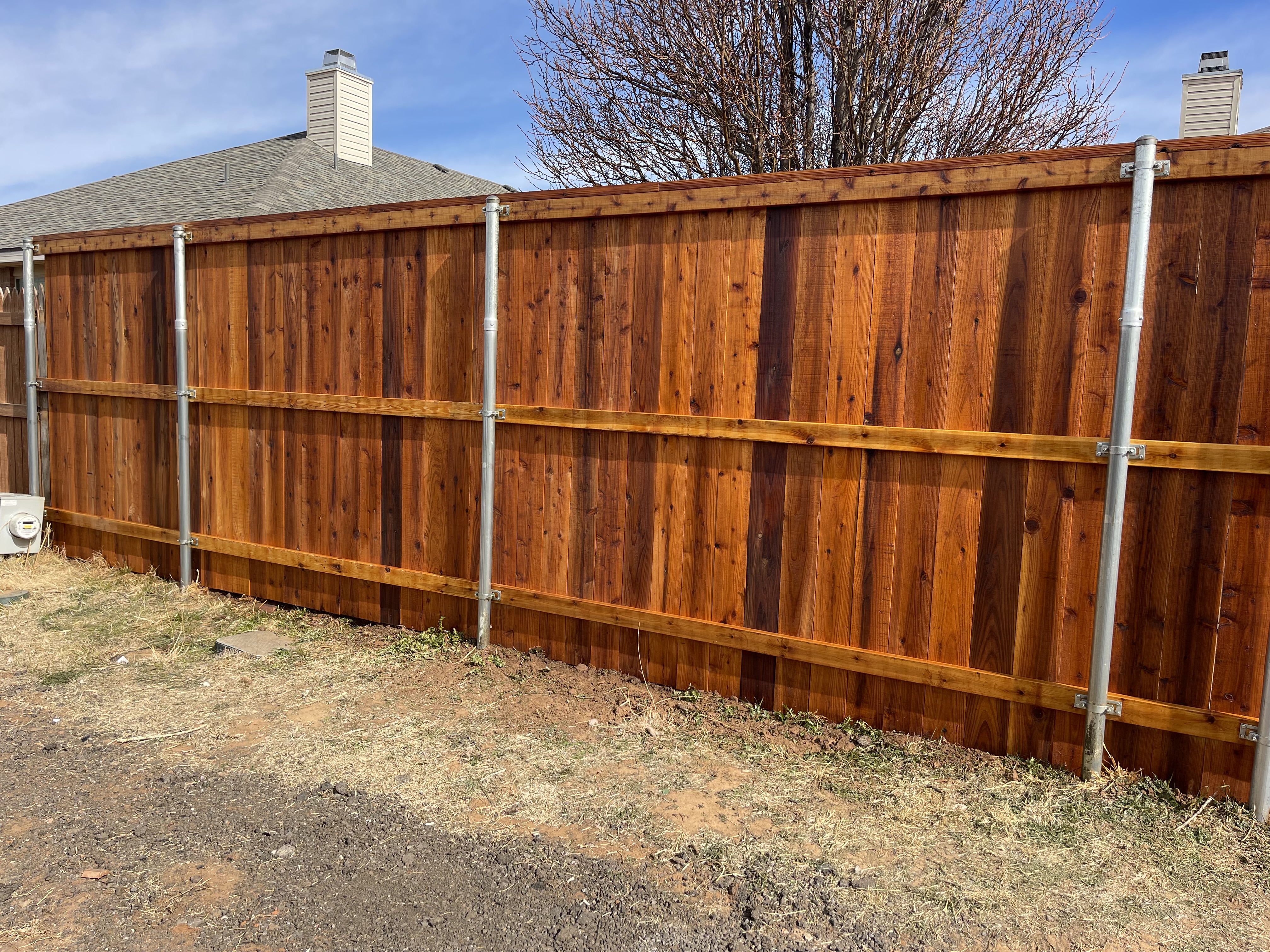 7-ft cedar fence w/ cedar tone stain protection