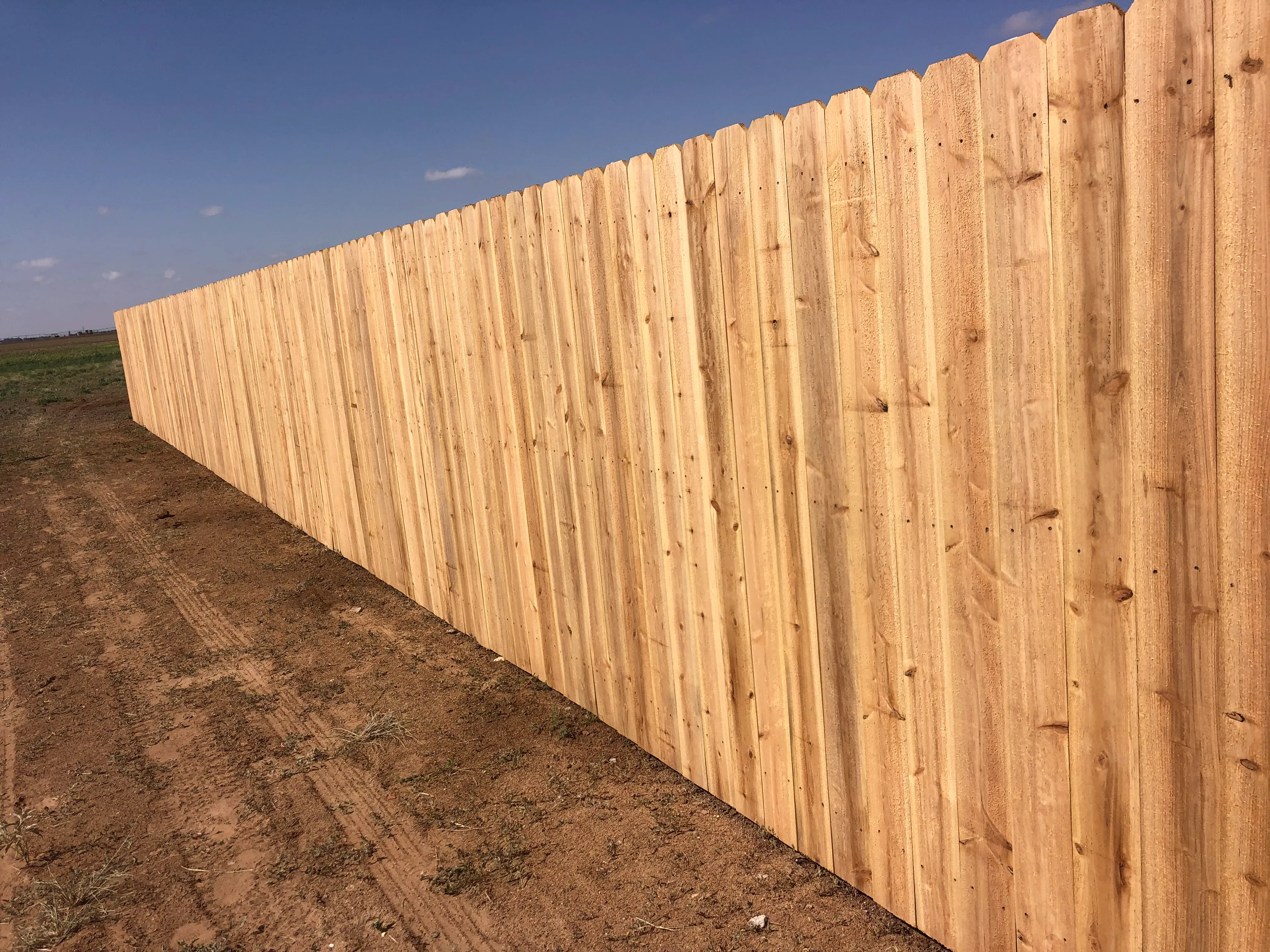 7-foot cedar privacy fence with dog-ear pickets installed in Lubbock Texas