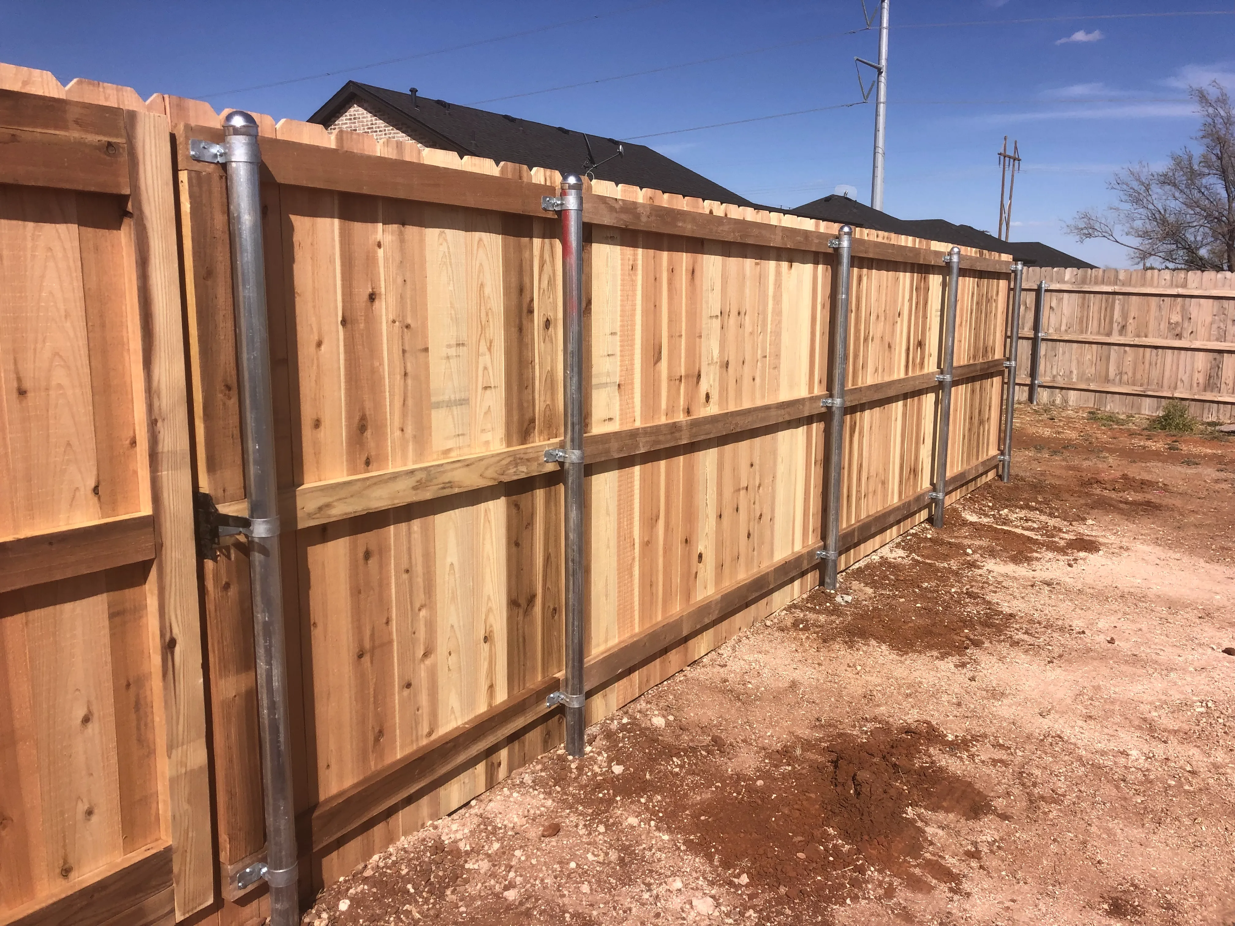 Cedar privacy fence corner detail close-up in Lubbock Texas
