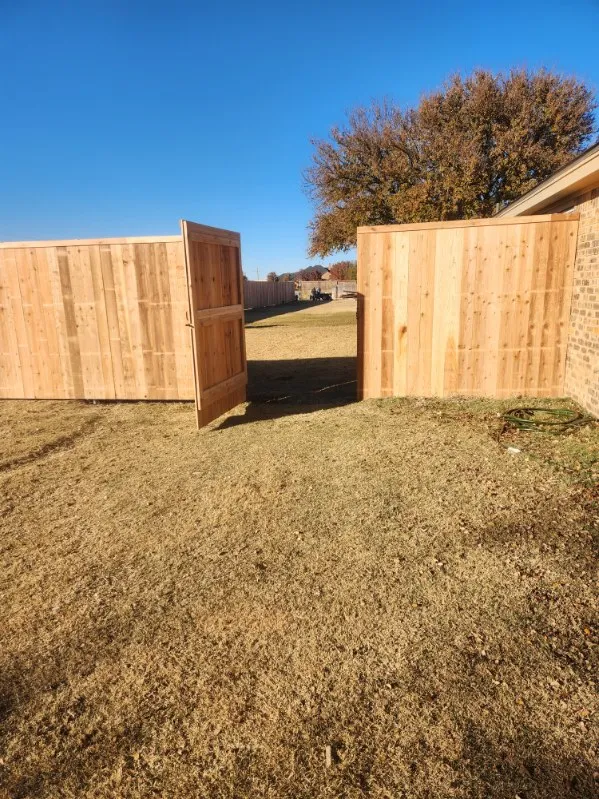 Gate hardware detail showing heavy-duty hinges and latch system