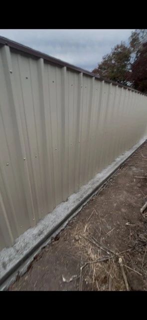 Light stone metal fence with Tudor Brown cap
