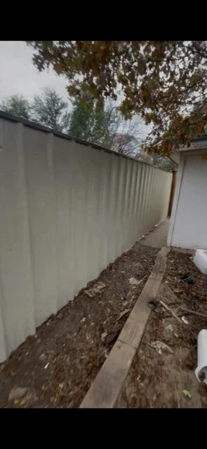 Light stone metal fence with Tudor Brown cap