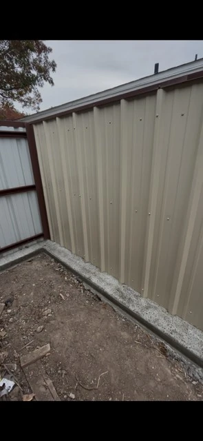 Light stone metal fence with Tudor Brown cap