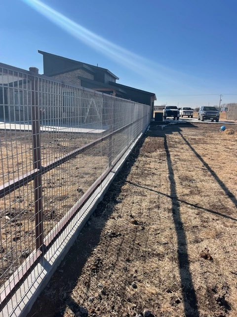 Ranch-rail style welded wire fence installed for pasture and livestock containment in Lubbock Texas