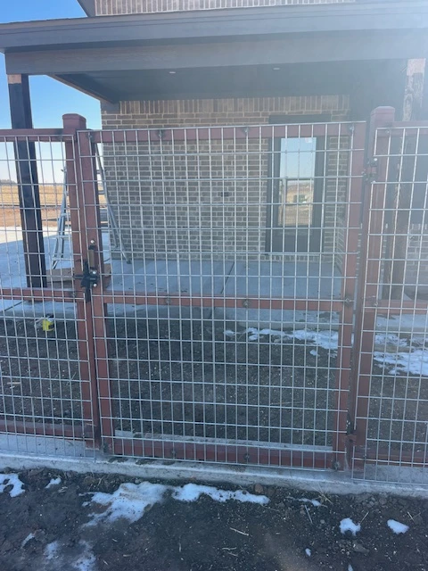 6'-wide ranch-rail style welded wire gate with steel frame and concrete footing in Lubbock Texas