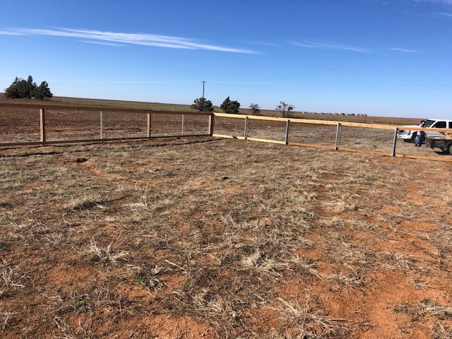 Custom ranch rail fence corner with wire mesh fencing designed for acreage properties, farm fencing, horse fencing, and residential land boundaries