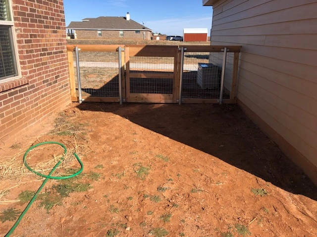 4-foot wood ranch rail fence with custom walk-through gate and welded wire mesh fencing providing secure backyard access and pet containment